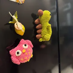 Another look at our adorable crochet fridge magnets. They are a fun and quirky way to personalize your kitchen space.