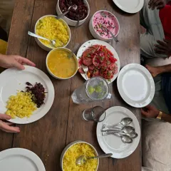 A top-down view of our communal dining table. Sharing meals together is a huge part of the retreat experience, a time for connection, laughter, and enjoying wholesome food.