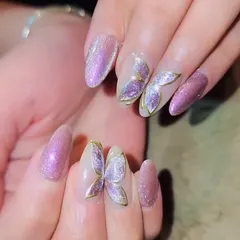 These 3D butterfly nails are perfect for making a statement at any event. The intricate details and sparkling pink base create a magical and unforgettable look.
