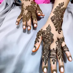 A beautiful, bold floral design that focuses on the back of the hands. The shading on the roses gives them a three-dimensional look.