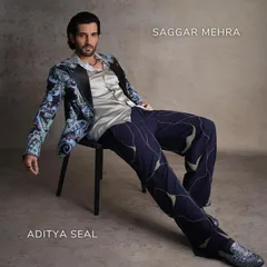 Aditya Seal on the cover of FHM India, embodying bold sophistication in our light blue printed tuxedo. The look is balanced with deep grey and white details for a modern twist on formalwear.