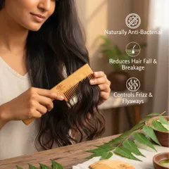 A model demonstrates the use of my Neem wood comb, which is naturally anti-bacterial, reduces hair fall, and controls frizz.