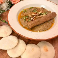 A true taste of Kashmir, our Mutton Harissa is a rare find in Delhi. It's a slow-cooked, hand-pounded lamb porridge, incredibly rich and served with a traditional Kashmiri seekh kebab on top.