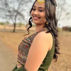A happy client enjoying her look. This simple, elegant makeup is perfect for a guest at a wedding or a festive celebration.