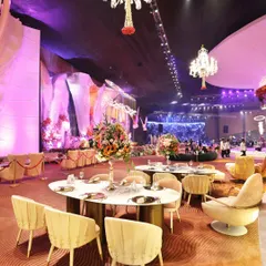 An opulent event space with dramatic lighting and elegant table settings. My team is equipped to serve in the most luxurious of venues, matching the grandeur with our service.