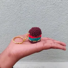 A burger that doesn't make you fat! This tiny crochet burger keychain is a fun and quirky accessory for any foodie.