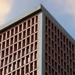 A detail shot of the corner of Project 723, highlighting the brick jaali pattern. This screen provides privacy and ventilation while creating a strong geometric element that defines the building's character.