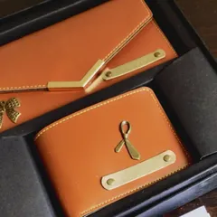 A close-up of the personalized couple's wallet set, a popular choice for wedding and engagement gifts.
