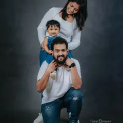 Love, laughter, and a fun family pose. We guide you into positions that feel natural and result in beautiful, connected family photographs.