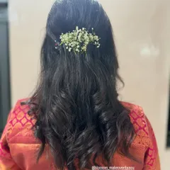 A back view of the soft curls hairstyle. This style is perfect for wedding guests or for a reception, as it's both romantic and comfortable to wear.