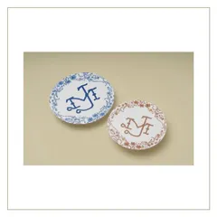 These custom monograms were inspired by Dutch Delft blue pottery and Indian florals to represent the couple's heritage. We created two versions, one in classic blue and another in a rustic orange for their Indian wedding.