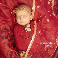 For this Navratri newborn photo, I added a delicate floral headband. It's these small touches that make each portrait unique and beautiful.