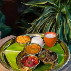 This is Vazhakoombu, or Banana Blossom Thoran, an unconventional delight. Made from the tender banana heart and cooked with green moong lentils, it has a unique texture and flavor that elevates any meal.