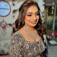 A close-up of the Sangeet makeup. The focus is on the dramatic eyes, balanced with soft, glowing skin and a neutral lip color.