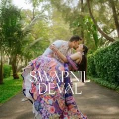 A dramatic and romantic dip-kiss pose. This shot is perfect for couples who want a touch of Bollywood flair in their wedding album.