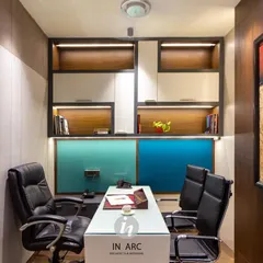 A view of one of the administrative cabins in the school. The design incorporates built-in shelving with wood accents and integrated lighting, creating a compact but highly functional workspace.