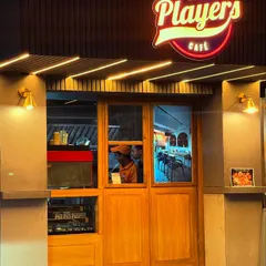 The entrance to The Players Cafe. Our kitchen is open for takeaway, in-car dining, and online delivery, serving your favorite coffee and meals.
