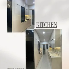 A complete look at a modern galley kitchen we designed. This space features handleless off-white cabinets, a striking marble-look countertop and backsplash, and a tall, tinted mirror cabinet for added depth.