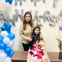 My daughter and I with the beautiful anniversary cake. It is a blessing to share these important moments with family.