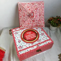 A beautiful memory box for an engagement anniversary, containing a pyramid card album and pop-up cubes with photos.