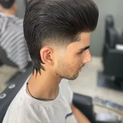 A stylish wolf cut, which is a variation of the mullet with more layers and texture. It's a very popular and trendy look right now.