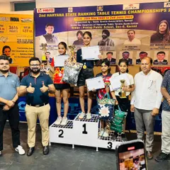 Here I am with our champions on the podium at the 2nd Haryana State Ranking Table Tennis Championships. It is an honor to stand with these talented young athletes as they receive their awards.