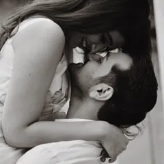 Pure joy and romance in one frame. We love capturing these spontaneous, playful moments that show a couple's true personality. This black and white shot feels intimate and timeless.