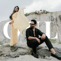A cinematic, wide-screen style shot from a quarry pre-wedding session. The dramatic landscape and the stylish couple create a photo that looks like a poster for a romantic epic.