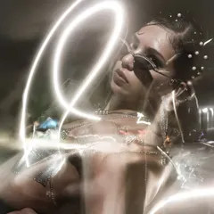 An experimental shot using long exposure and light painting to create swirls of light around the model for a futuristic feel.