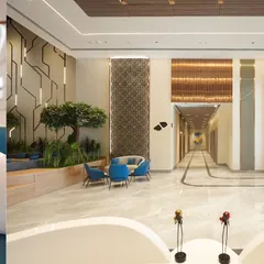 Capturing the scale of this expansive corporate lobby for Architect Reza Kabul required a composition that shows both its depth and its design elements. This triptych-style image displays the long hallway, the comfortable seating areas, and intricate wall panels, giving a full sense of the impressive space.