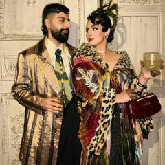 A full-length shot of the 1920s-themed couple for GQ. The sleek, sculpted waves were essential for creating an authentic look that matched the vintage wardrobe.