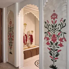 Hand-painted floral motifs inspired by traditional Indian design, created for a serene prayer room. The artwork adds a sense of handcrafted elegance and spiritual calm to the sacred space.
