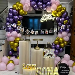 I can combine light-up numbers and a photo banner for a truly personal touch. This 25th birthday setup features a glowing '25' and a string of photos, allowing you to celebrate memories while making new ones.