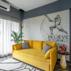 Another look at the boy's room, focusing on the vibrant yellow sofa and the inspiring "Believe in Yourself" wall mural. It's a space designed to be both comfortable for lounging and motivating for a young athlete.