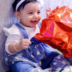A candid portrait of the birthday girl sharing a joyful smile. I love capturing the sweet, fleeting moments of childhood during kids' birthday photoshoots.