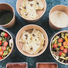 A complete Italian meal, packed and ready for delivery. This order included my handmade truffle ravioli, a fresh salad, and individual portions of tiramisu for dessert.