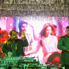 A perfect example of my live dhamaka offering at a wedding. I'm mixing tracks while a percussionist adds a live dhol beat, creating a powerful fusion of electronic and traditional Indian music.