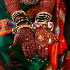 Celebrating the journey to motherhood with a custom baby shower mehendi. This design features sweet details like baby feet and cradles, all surrounded by festive floral jewellery.
