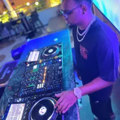 In the zone, focused on the mix. I use a professional Pioneer DJ setup to have full control over the music, ensuring every transition is seamless and the energy on the dance floor never drops.