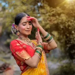 A serene, sun-kissed portrait with the model's eyes closed, capturing a moment of peace and beauty.