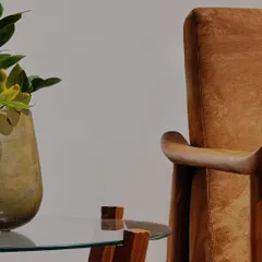This custom armchair is a testament to artistry, with its sculpted teak armrests and comfortable upholstery. It’s designed not just as a seat, but as a functional piece of art for your living room.