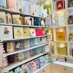 Another view of our extensive collection on display. We encourage you to come in and feel the different paper qualities and see the intricate details up close.
