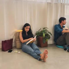 Finding a quiet spot on the floor to get lost in a book. Our Studio space is perfect for these moments of calm and focus.