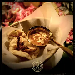 The quintessential pairing of creamy Dal Makhani and flaky naan bread, served in traditional copper and brassware. A comforting and classic dish that we perfect.