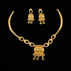 This is a product shot of the premium gold necklace set, highlighting the intricate craftsmanship and filigree work on the pendant and matching earrings. The design is perfect for retailers catering to clients who appreciate royal elegance.