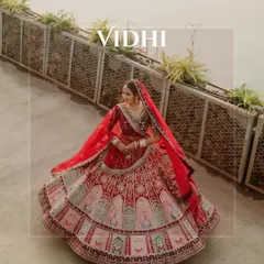 A full-length shot of the bride's magnificent red lehenga. We work with photographers to capture every detail of your carefully chosen wedding outfits.