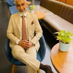 Here is a valued client, Mr. Rashid Khan, looking distinguished in a single-breasted beige suit I tailored for him. The ensemble is completed with a French double cuff shirt, demonstrating a perfect blend of classic style and personal fit.