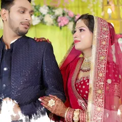 A candid, romantic moment between the couple during their wedding reception, beautifully captured for their album.