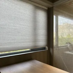This newly finished office space is bathed in natural light. The use of translucent blinds allows for privacy while still keeping the environment bright and inspiring.