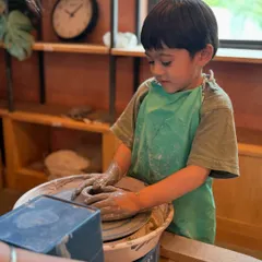 Look at the focus on this little artist's face. Our kids' sessions are all about giving children a chance to get their hands messy, build patience, and create something they can be proud of.